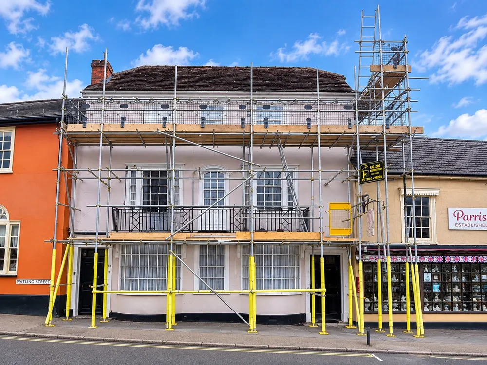 Scaffolding with pedestrian protection on a period high street building