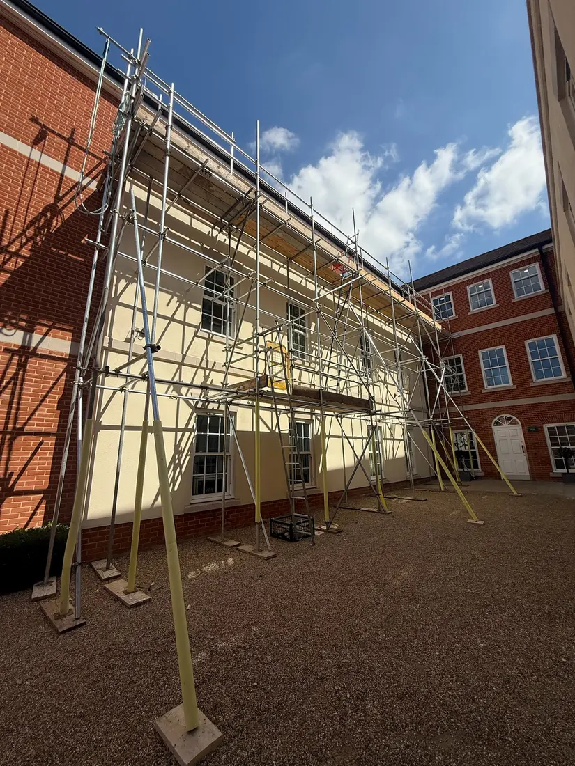 Long run of scaffolding along a residential block