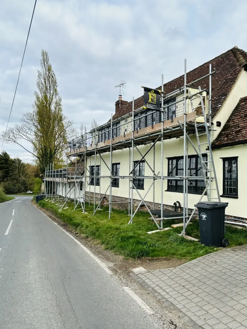 Full-length scaffold on a roadside cottage