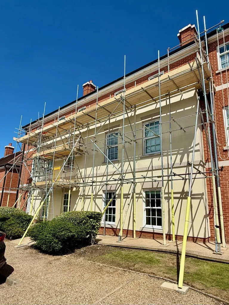 Scaffold on a rendered and brick building by Falcon Scaffolding