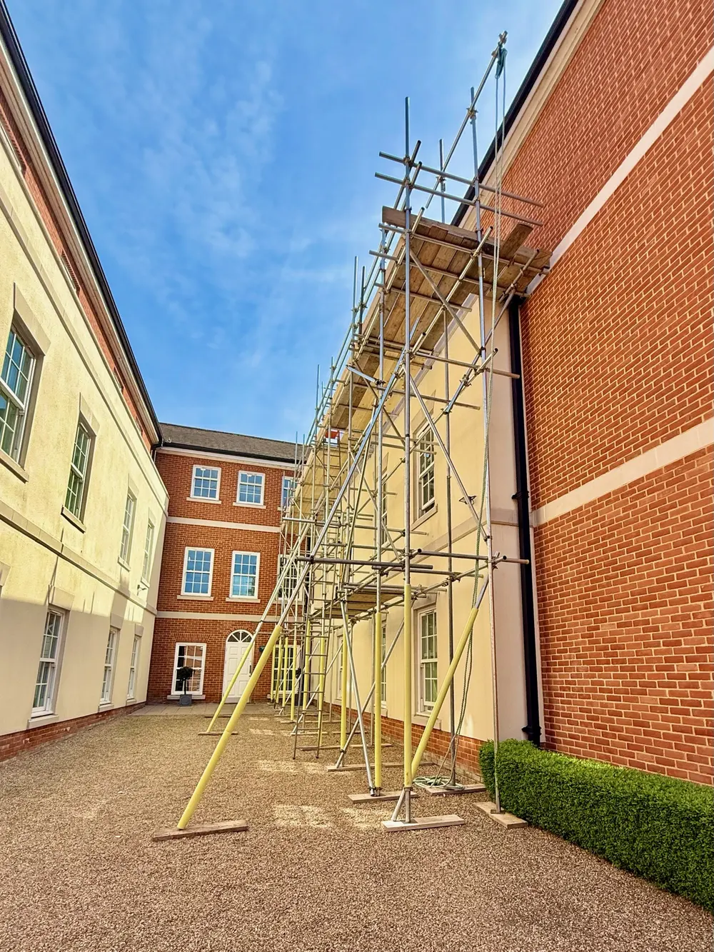 Scaffold along a large residential block by Falcon Scaffolding